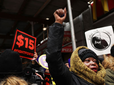 Protesters with NYC Fight for $15 gather in front of a McDonald's on February 13, 2017, in New York City.
