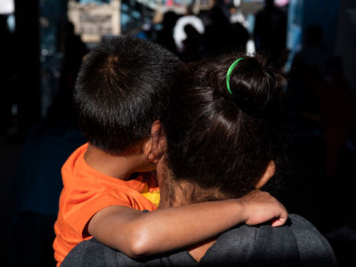 A mother and son from Guatemala stand for a portrait at Instituto Madre Asunta shelter for migrants in Tijuana, Mexico on February 15, 2019.