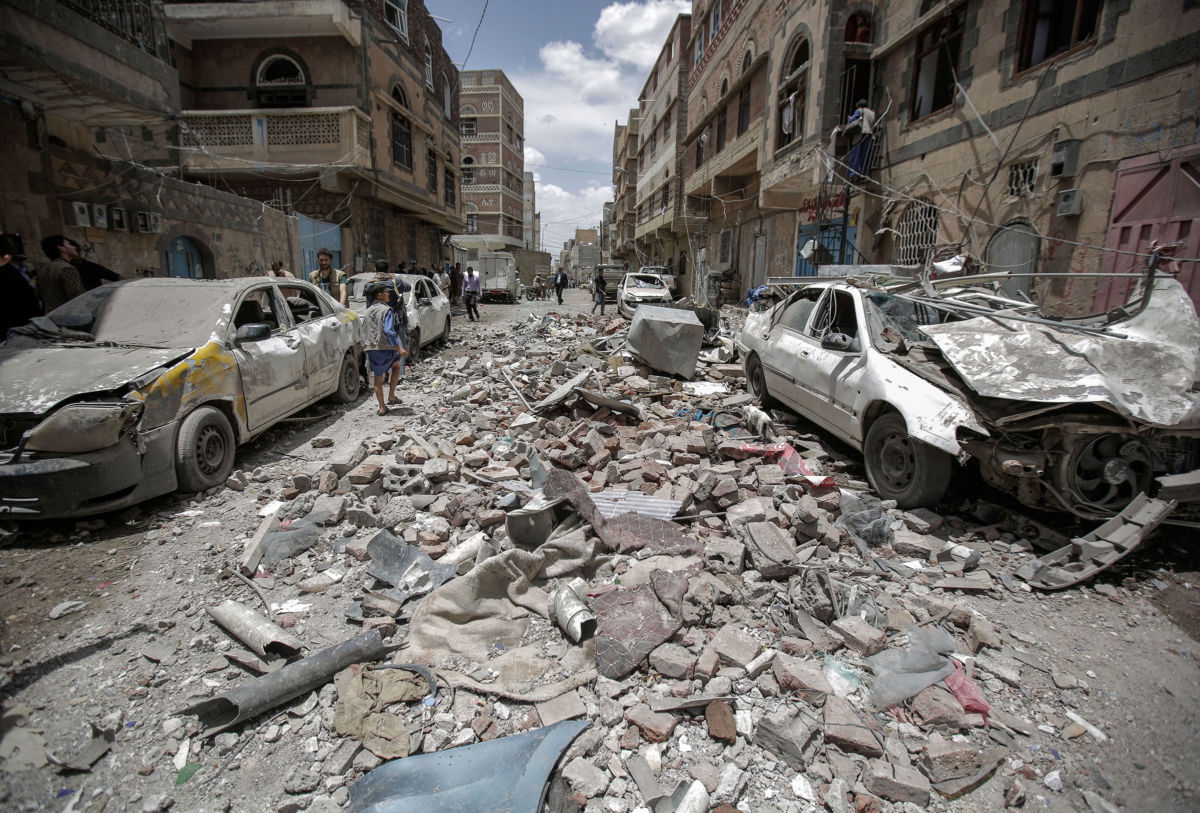 Yemenis inspect the site of a Saudi-led coalition airstrike, May 16, 2019.