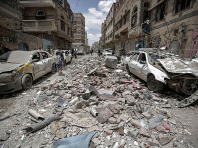 Yemenis inspect the site of a Saudi-led coalition airstrike, May 16, 2019.