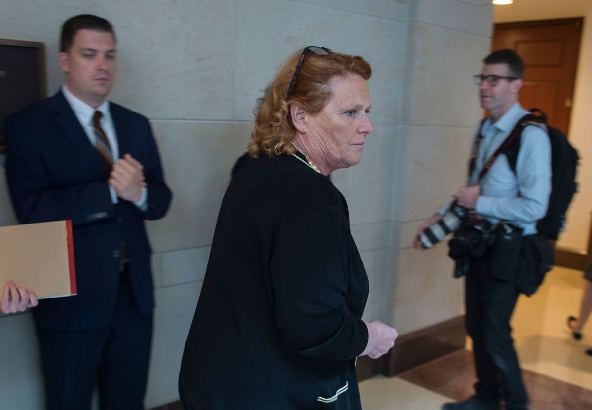 Sen. Heidi Heitkamp walks out of a room after reading the report on the FBI investigation into Supreme Court nominee Brett Kavanaugh on Capitol Hill in Washington, D.C., on October 4, 2018. Heitkemp along with Sen. Joe Donnelly recently announced the launch of the One Country Project to bring rural voters back to the Democratic Party, but the nonprofit has anti-Medicare for All ties.