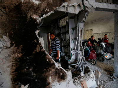 Palestinian amputees break their Ramadan fast at a community center in Rafah, which was destroyed by Israeli warplanes.