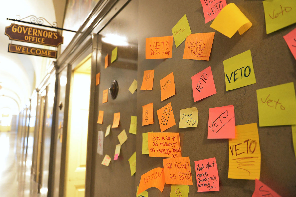 Post-it notes with messages calling for a veto are seen outside Missouri Gov. Mike Parson's office on May 17, 2019, in Jefferson City, Missouri.