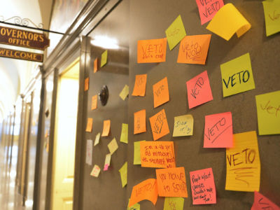 Post-it notes with messages calling for a veto are seen outside Missouri Gov. Mike Parson's office on May 17, 2019, in Jefferson City, Missouri.