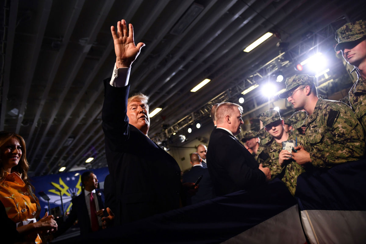 President Donald Trump and First Lady Melania Trump greet Marines aboard the amphibious assault ship USS Wasp during a Memorial Day event in Yokosuka on May 28, 2019.