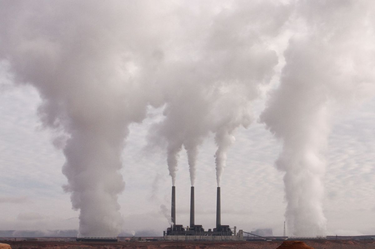 Smokestacks from a power plant billow pollution into the air