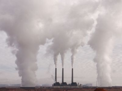 Smokestacks from a power plant billow pollution into the air