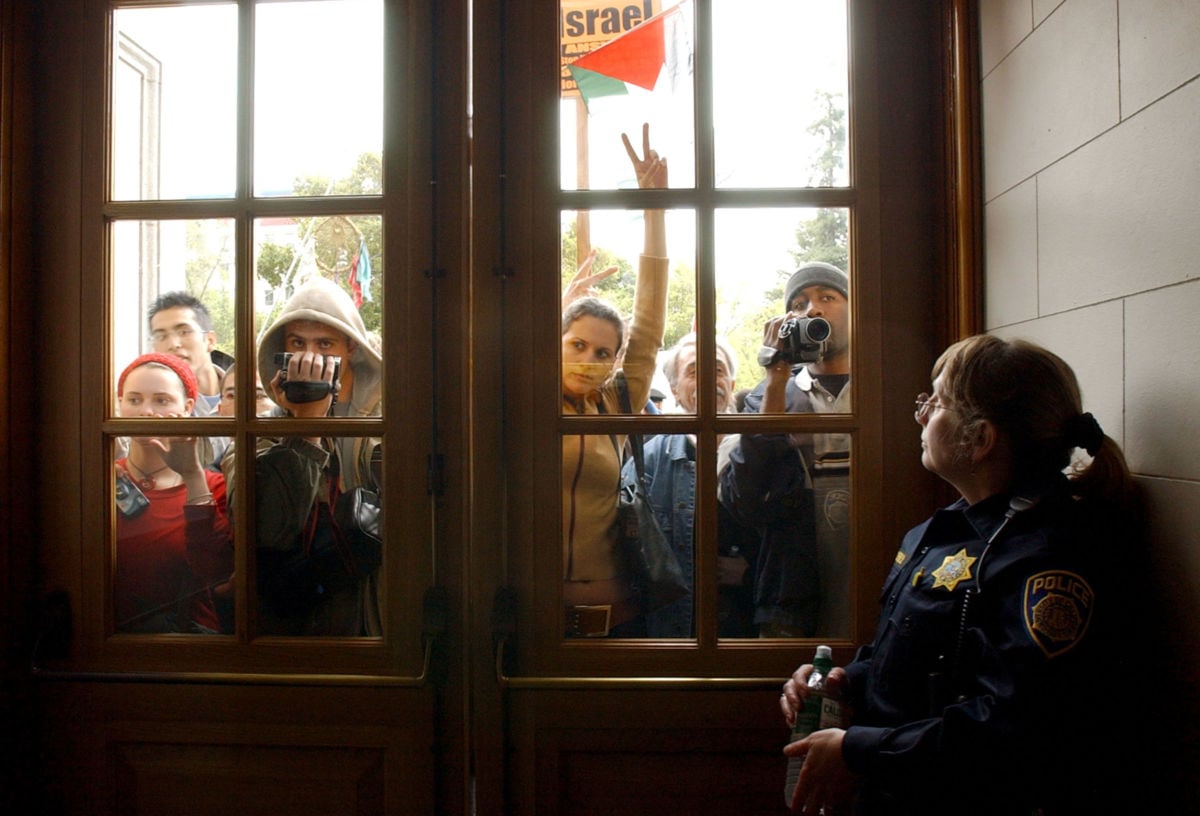 Pro-Palestinian demonstrators at University of California, Berkeley, rally outside a sit-in in 2002. Campus protests such as these now face increasing attacks from a campaign jointly orchestrated by Evangelical Christian conservatives and right-wing Zionists to silence critics of Israel.