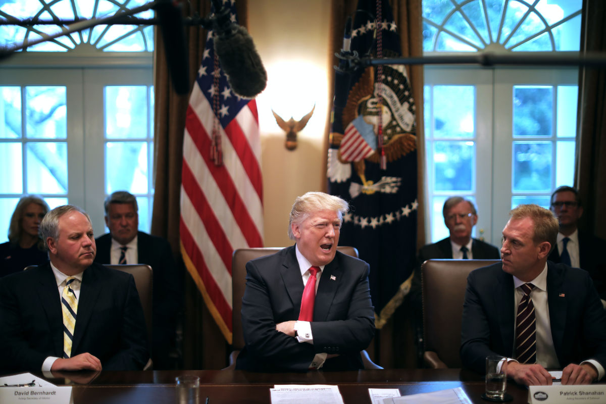 David Bernhardt, Donald trump and Patrick Shanahan sit at a table