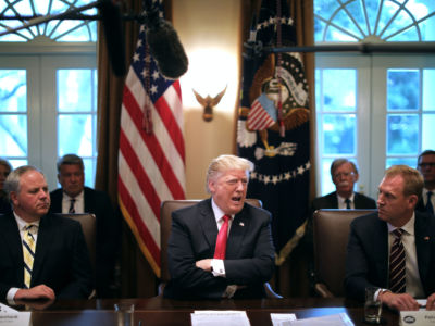 David Bernhardt, Donald trump and Patrick Shanahan sit at a table