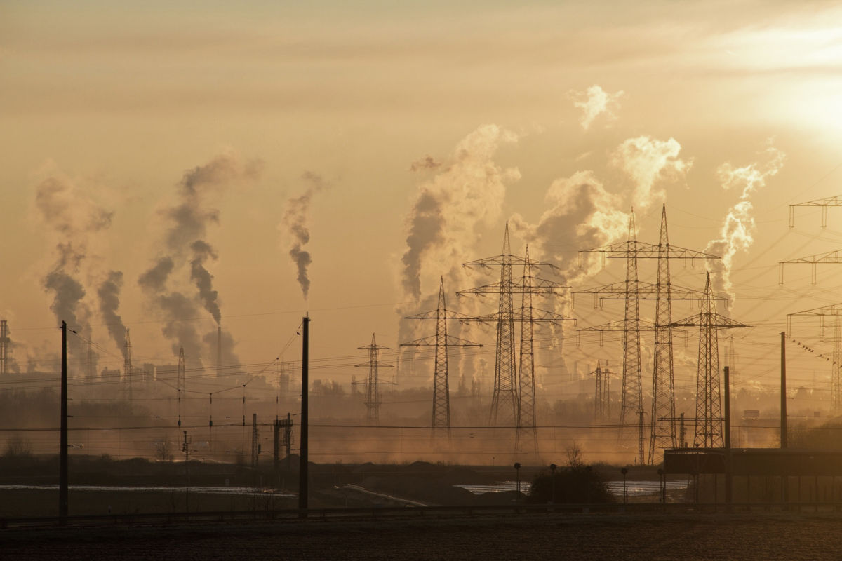 Smokestacks in a power plant blast smog into the air