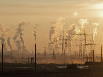 Smokestacks in a power plant blast smog into the air