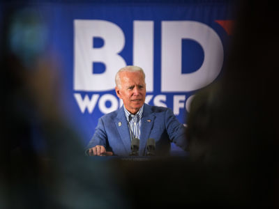 Joe Biden is seen speaking on a stage