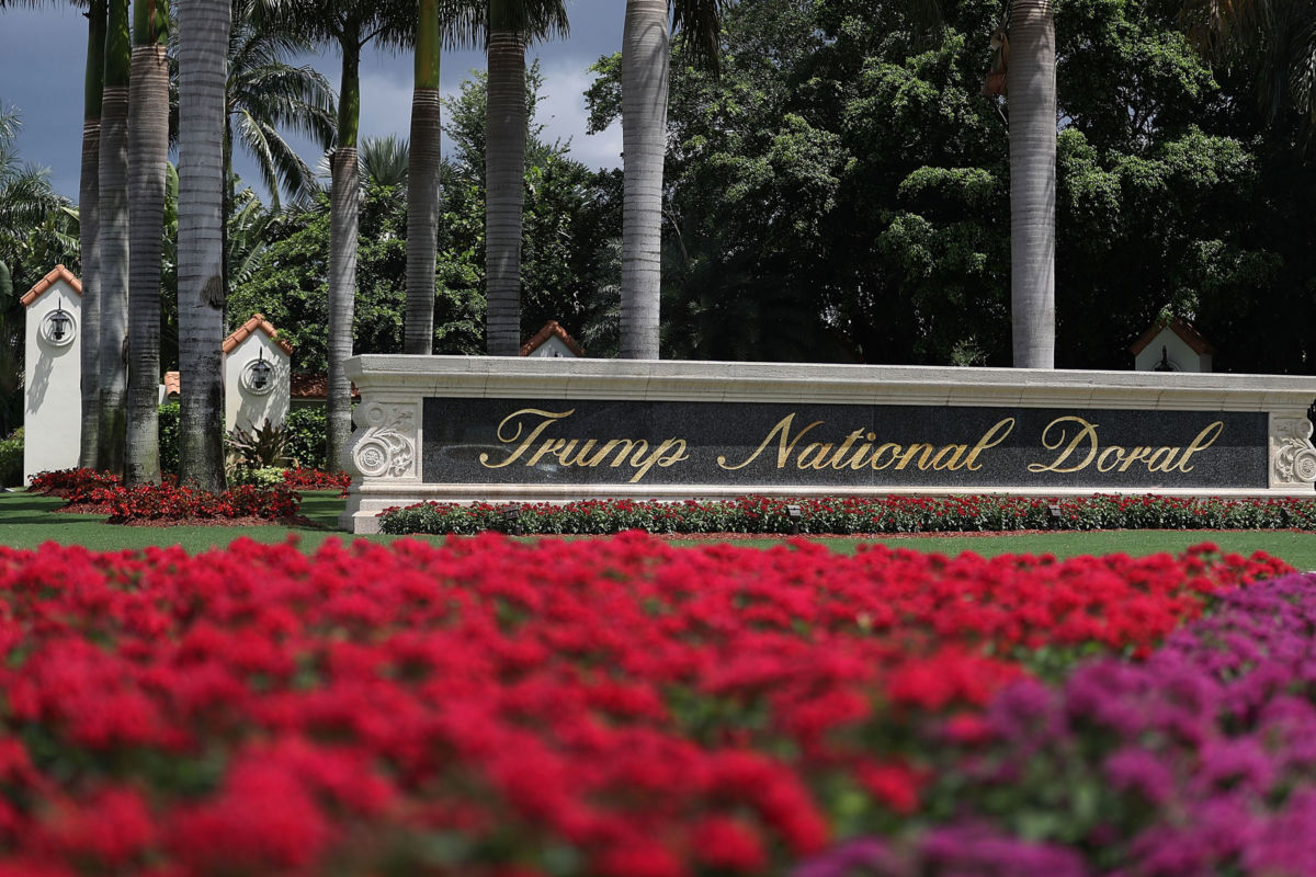 A sign reading Trump National Doral is seen on the grounds of the golf course owned by President Trump on June 1, 2016, in Doral, Florida.