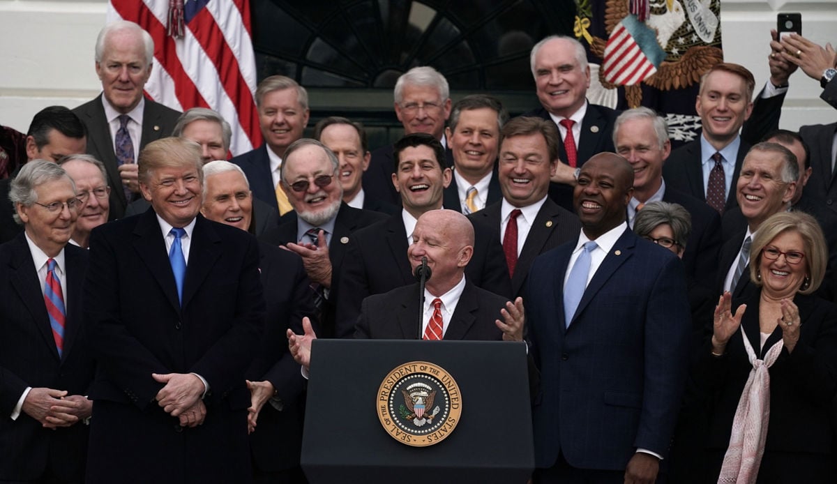 Rep. Kevin Brady stands at the podium with Republican members of the House and Senate