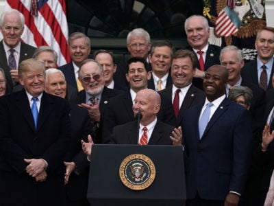 Rep. Kevin Brady stands at the podium with Republican members of the House and Senate