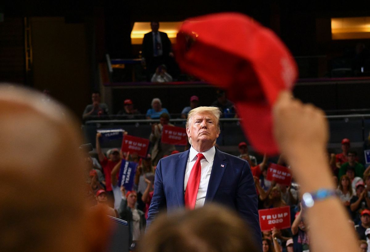 Donald Trump looks out at a crowd of his supporters during a rally