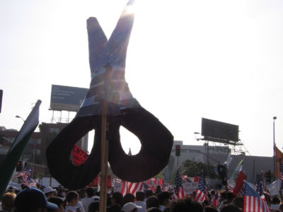 A scissors sign, representing the Garment Worker Center, is seen at a May Day march in Los Angeles, California, May 1, 2006.