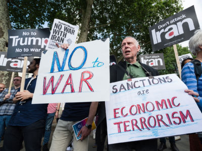 Anti-war demonstrators gather outside Downing Street on June 26, 2019, in London, England, to call on the government to publicly oppose the escalation of conflict between Donald Trump's administration and Iran and demand that military action is ruled out.