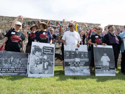 A group of Japanese Americans who were held in concentration camps in WWII pose with photos of themselves during a press conference on June 22, 2019, in Lawton, Oklahoma, to protest the military base, Fort Sill, being used to house 1,400 migrant children.