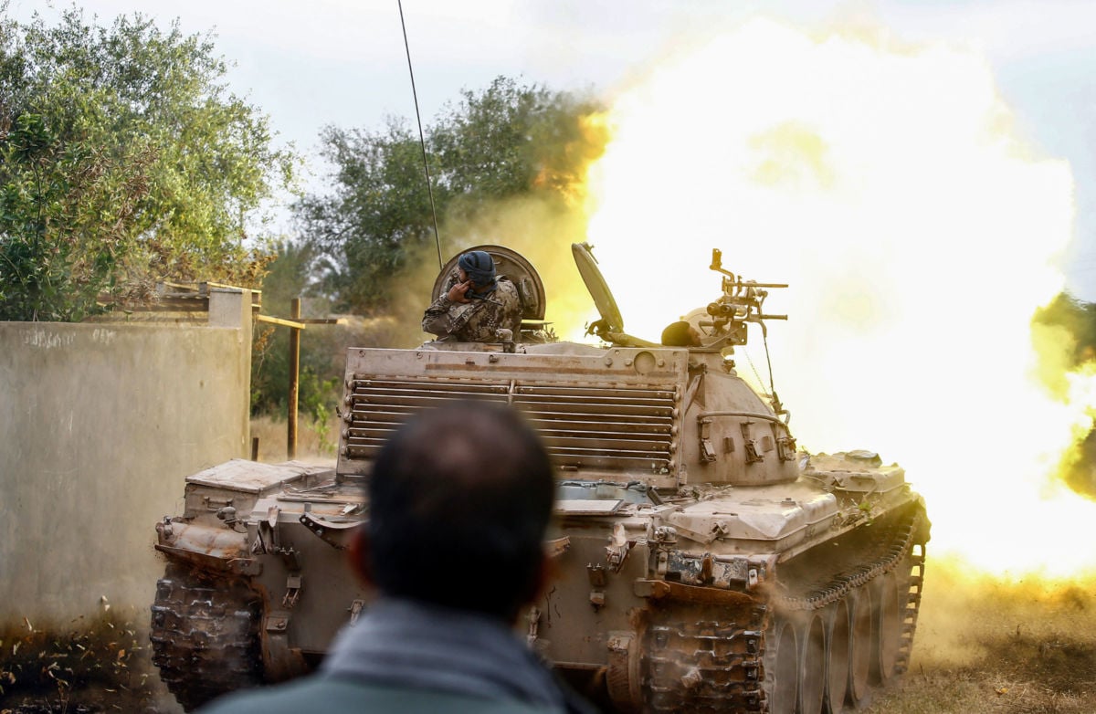 A tank loyal to the Libyan Government of National Accord (GNA) fires during clashes against forces loyal to strongman Khalifa Haftar, on June 1, 2019, south of the Libyan capital Tripoli.