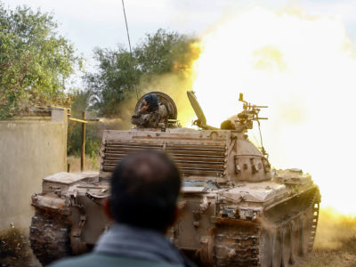 A tank loyal to the Libyan Government of National Accord (GNA) fires during clashes against forces loyal to strongman Khalifa Haftar, on June 1, 2019, south of the Libyan capital Tripoli.