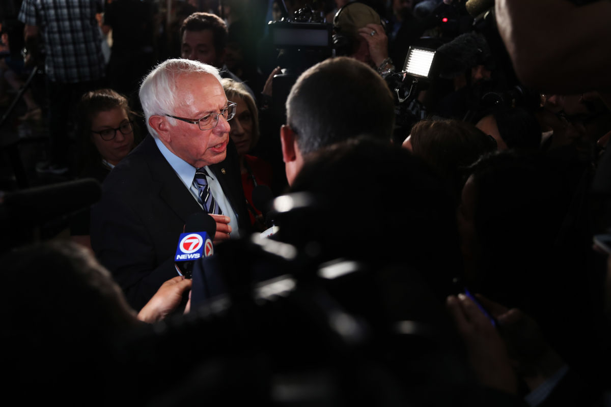 Bernie speaks to supporters surrounding him at all sides