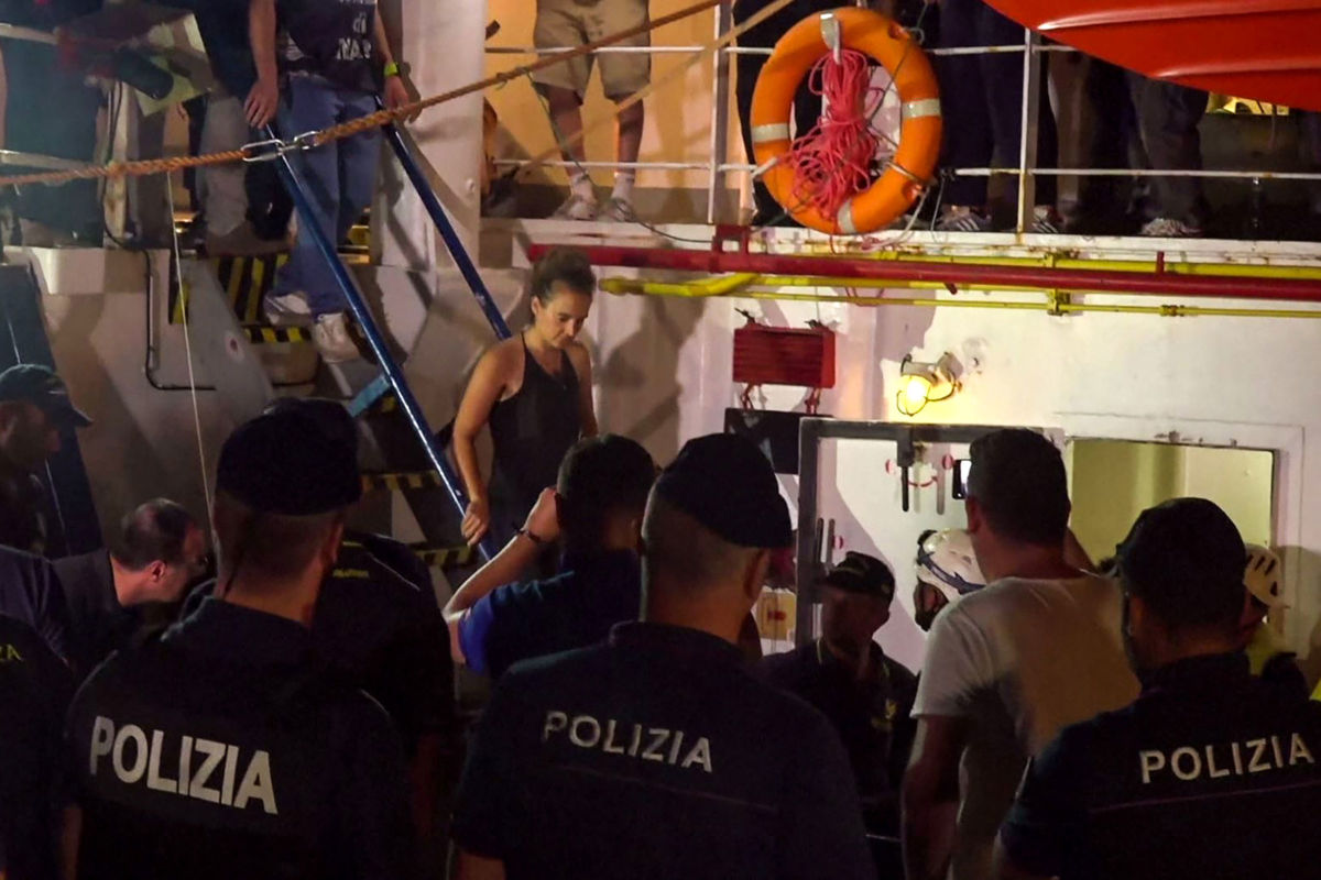 An image grab taken from a video released by Local Team on June 29, 2019, shows the Sea-Watch 3 charity ship's German captain Carola Rackete being arrested by Italian police, in the Italian port of Lampedusa, Sicily.