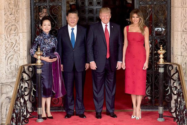 President Donald Trump and First Lady Melania Trump pose for a photo with Chinese President Xi Jingping and his wife, Mrs. Peng Liyuan, Thursday, April 6, 2017, at the entrance of Mar-a-Lago in Palm Beach, Florida.