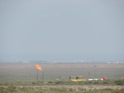 Fire shoots from a natural gas pump