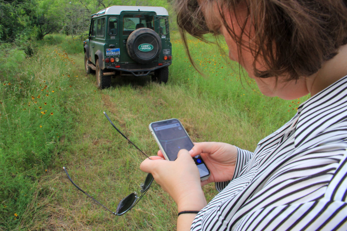 Lucy Johnson stops to check a map of her family's 3,800-acre ranch as we navigate to Kinder Morgan's pipeline easement on May 27, 2019.