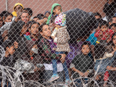 This March 27, 2019, photo shows migrants crammed inside a makeshift jail in El Paso, Texas. Conditions in the migrant prisons are setting the stage for a multigenerational health catastrophe.