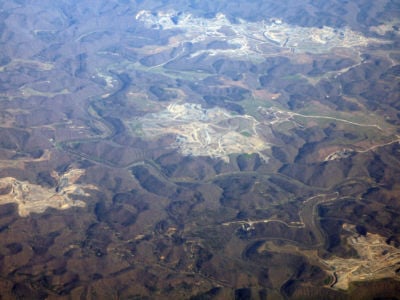 The Bureau of Prisons has for years been proposing to build an 800-acre, maximum security prison on a mountaintop removal site in Kentucky, like one of those pictured above.