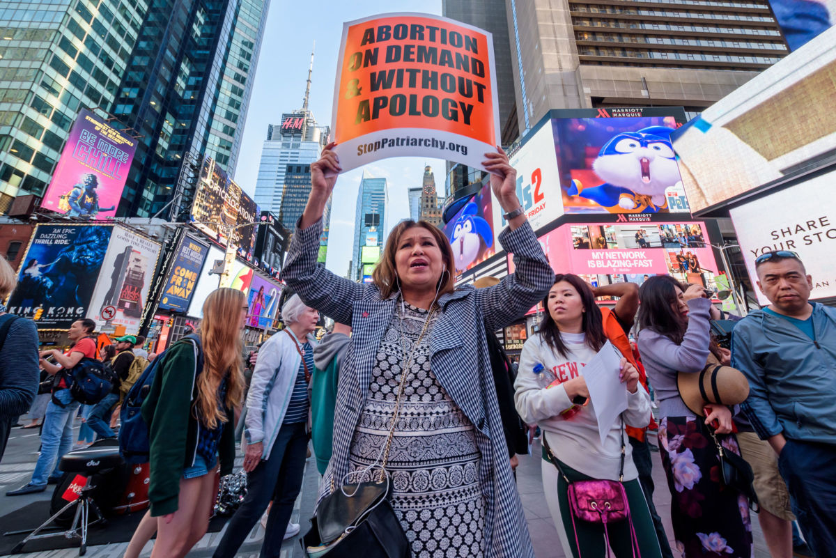 Protesters demanding 'Abortion Without Apology' gathered at the Times Square Red Step as part of a national day of action against abortion bans.