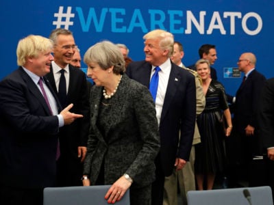 President Trump speaks to NATO Secretary General Jens Stoltenberg and British Foreign Minister Boris Johnson as Britain's Prime Minister Theresa May passes during a working dinner meeting at the NATO headquarters in Brussels on May 25, 2017.