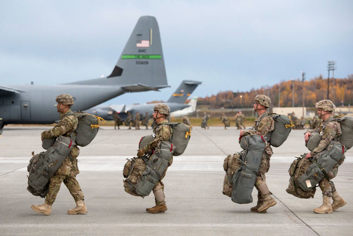 U.S. Army paratroopers board aircrafts while conducting an airborne assault exercise at Joint Base Elmendorf-Richardson, Alaska, October 9, 2018.