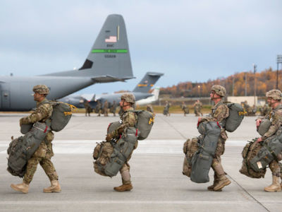 U.S. Army paratroopers board aircrafts while conducting an airborne assault exercise at Joint Base Elmendorf-Richardson, Alaska, October 9, 2018.