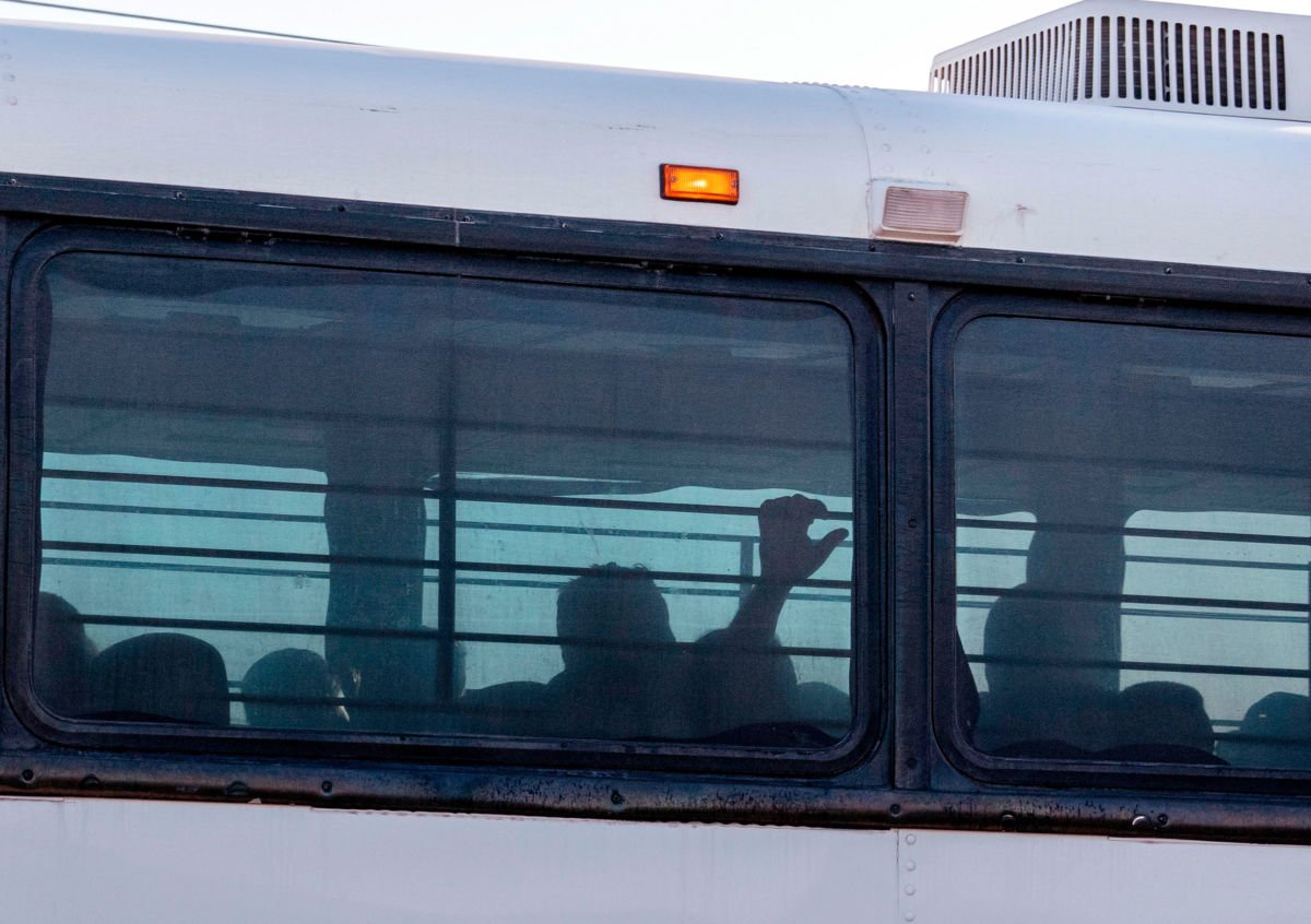 A bus transporting immigrants leaves a temporary facility at a U.S. Border Patrol Station in Clint, Texas, on June 21, 2019.