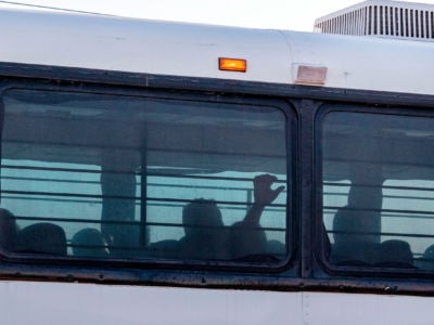 A bus transporting immigrants leaves a temporary facility at a U.S. Border Patrol Station in Clint, Texas, on June 21, 2019.
