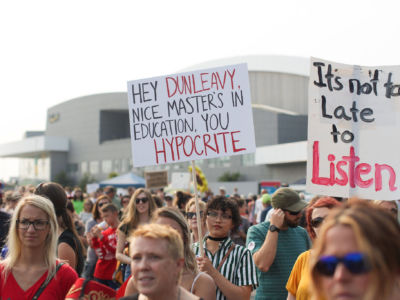 Students protest Alaska Gov. Mike Dunleavy’s budget cuts at the University of Alaska, Anchorage campus.