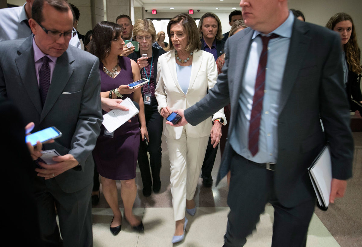 Speaker of the House Nancy Pelosi is trailed by reporters following a press conference at the U.S. Capitol on July 17, 2019, in Washington, D.C.