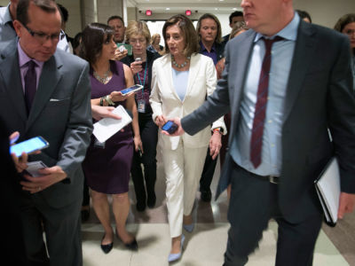 Speaker of the House Nancy Pelosi is trailed by reporters following a press conference at the U.S. Capitol on July 17, 2019, in Washington, D.C.