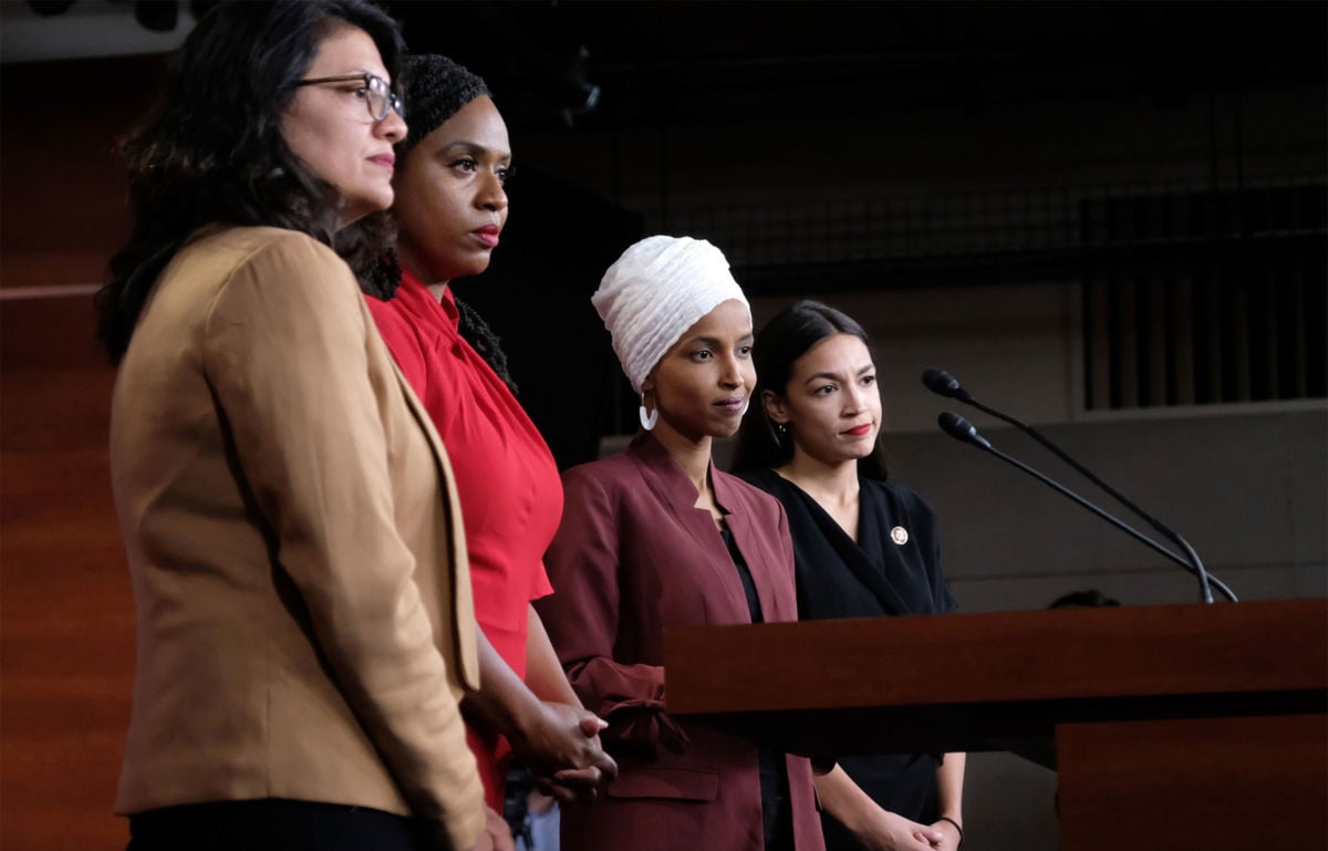 Reps. Rashida Tlaib, Ayanna Pressley, Ilhan Omar and Alexandria Ocasio-Cortez pause between answering questions during a press conference at the U.S. Capitol on July 15, 2019, in Washington, D.C.