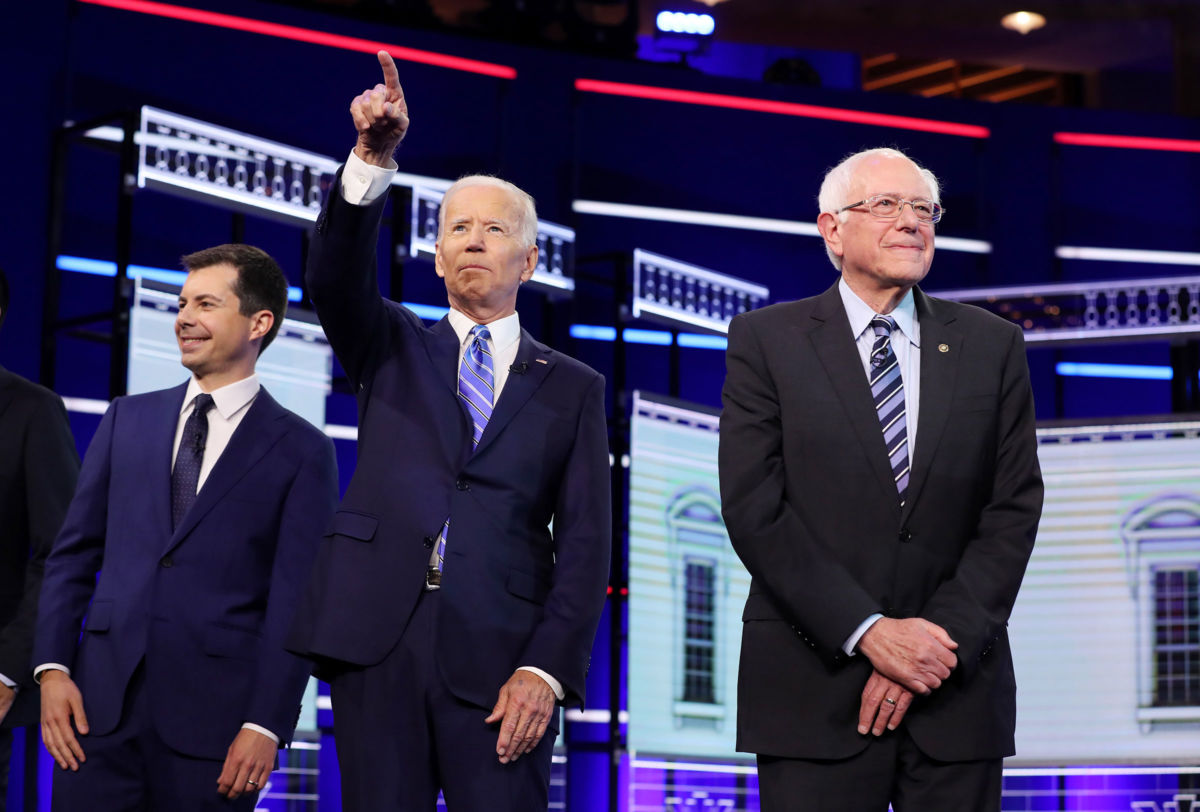 Democratic presidential candidates South Bend, Indiana Mayor Pete Buttigieg, former Vice President Joe Biden and Sen. Bernie Sanders take the stage for the second night of the first Democratic presidential debate on June 27, 2019, in Miami, Florida.