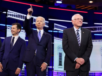Democratic presidential candidates South Bend, Indiana Mayor Pete Buttigieg, former Vice President Joe Biden and Sen. Bernie Sanders take the stage for the second night of the first Democratic presidential debate on June 27, 2019, in Miami, Florida.