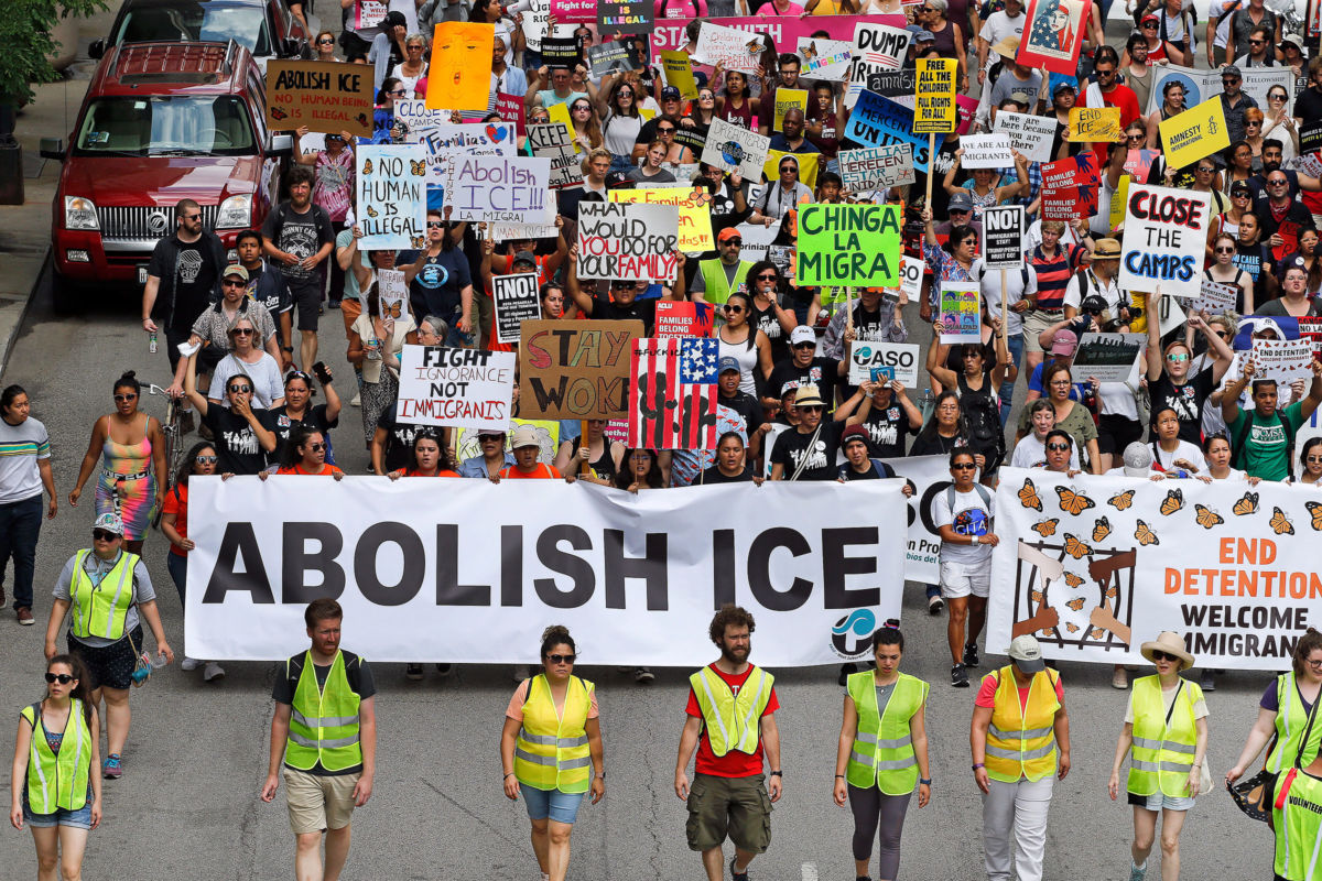Protesters march to offices of the U.S. Immigration and Customs Enforcement on July 13, 2019, in Chicago, Illinois.