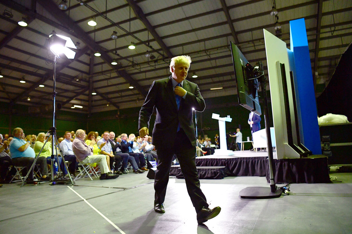 Boris Johnson leaves the stage after addressing Conservative Party members on July 13, 2019, in Colchester, England.