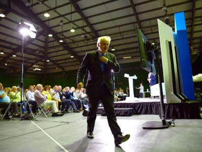 Boris Johnson leaves the stage after addressing Conservative Party members on July 13, 2019, in Colchester, England.