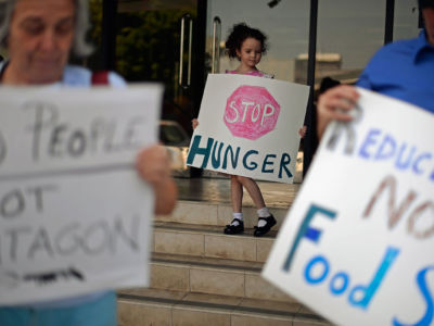 Demonstrators protest cuts to food stamps in Los Angeles, California, June 17, 2013.