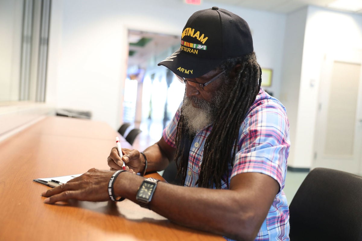 Clarence Singleton registers to vote at the Lee County Supervisor of Elections office on January 8, 2019, in Fort Myers, Florida. Mr. Singleton was able to register to vote for the first time after his right to vote was taken away in 2008 as a new constitutional amendment took effect.